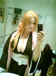  big_boobs bleach breasts cellphone cleavage cosplay large_breasts matsumoto_rangiku non-asian phone photo real red_hair redhead 
