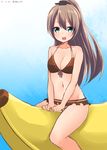  akky_(akimi1127) banana_boat bikini brown_hair green_eyes highres kantai_collection kumano_(kantai_collection) long_hair ponytail sitting solo swimsuit 