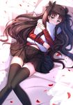  black_legwear blush brown_hair fate/stay_night fate_(series) green_eyes hair_ribbon highres holding jewelry long_hair long_legs lying navel necklace on_back petals pillow pillow_hug pleated_skirt ribbon skirt solo swordsouls thighhighs toosaka_rin two_side_up zettai_ryouiki 