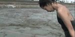  1girl animated animated_gif asian diving mud outdoors outside photo sailor_uniform serafuku swimsuit top-down_bottom-up 