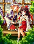  blonde_hair bow brown_hair detached_sleeves food fruit gap hair_bow hair_ribbon hair_tubes hair_up hakurei_reimu half_updo hat highres lips multiple_girls no_shoes popsicle purple_eyes red_eyes ribbon shade short_hair sidelocks sitting socks touhou veranda vetina water watermelon white_legwear yakumo_yukari 