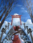  1girl absurdres bare_tree bow brown_hair detached_sleeves from_behind hair_bow hakurei_reimu highres nontraditional_miko ourie red_bow red_shirt red_skirt shirt skirt sky sleeveless sleeveless_shirt snow solo stairs torii touhou tree wide_sleeves 