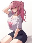  1girl black_shorts breasts cleavage hair_tie_in_mouth highres hololive hololive_english large_breasts long_hair mori_calliope mori_calliope_(streetwear) mouth_hold nokaa_aru pink_eyes pink_hair ponytail shirt shorts sitting skull_print virtual_youtuber white_shirt yokozuwari 