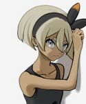  1girl bea_(pokemon) black_bodysuit black_hairband blonde_hair bodysuit bow_hairband closed_mouth collarbone commentary_request echizen_(n_fns17) eyelashes frown grey_eyes hair_between_eyes hairband hand_up pokemon pokemon_swsh short_hair solo upper_body white_background 