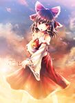  bow brown_eyes brown_hair detached_sleeves hair_bow hakurei_reimu midriff ofuda skirt sky solo touhou vienri 