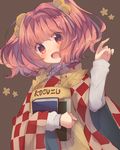  apron bell blush book brown_background character_name checkered hair_bell hair_ornament head_tilt highres image_sample long_sleeves looking_at_viewer motoori_kosuzu open_mouth red_eyes red_hair skirt smile solo touhou twitter_sample two_side_up upper_body usamata vest wide_sleeves 