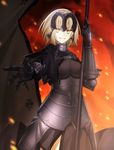  armor black_capelet blonde_hair capelet fate/grand_order fate_(series) fire flag gauntlets headpiece highres jeanne_d'arc_(alter)_(fate) jeanne_d'arc_(fate)_(all) looking_at_viewer minamina outstretched_arm pale_skin polearm short_hair smile solo weapon yellow_eyes 