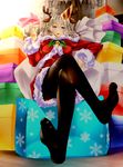  animal_ears antlers black_legwear blue_eyes gift hat highres kantai_collection kashima_(kantai_collection) looking_at_viewer pantyhose party_hat reindeer_antlers reindeer_ears santa_costume shizuki_shuuya silver_hair sitting smile solo twintails 