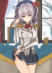  blue_eyes blush breasts epaulettes genji_(three_genji) gloves gloves_removed highres inkwell kantai_collection kashima_(kantai_collection) large_breasts letter picture_frame playing_with_hair silver_hair skirt skirt_lift smile snow solo thighs 