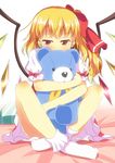  blonde_hair bow commentary_request covered_mouth doll_hug dress flandre_scarlet hair_bow indian_style long_hair looking_at_viewer puffy_short_sleeves puffy_sleeves red_dress red_eyes shirt short_sleeves side_ponytail sitting solo stuffed_animal stuffed_toy teddy_bear touhou wings yuimari 