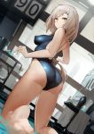  ass bare_legs barefoot blue_swimsuit blurry blurry_background blurry_foreground breasts brown_hair commentary competition_swimsuit covered_nipples depth_of_field dutch_angle foreshortening from_behind girls_frontline hair_ornament hairclip highres impossible_clothes impossible_swimsuit indoors kneeling large_breasts long_hair looking_back mossberg_m590_(girls_frontline) one-piece_swimsuit pandea_work parted_lips solo swimsuit yellow_eyes 