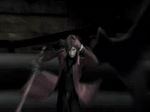  animated animated_gif blurry coat crisis_core_final_fantasy_vii earrings final_fantasy final_fantasy_vii genesis_rhapsodos jewelry lowres shoulder_pads single_wing smile spoilers squatting sword weapon wings 