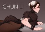  1girl alternate_color ass black_hair breasts bun_cover chinese_clothes chun-li double_buns female hair_bun large_breasts looking_at_viewer lying magion02 on_stomach pantyhose puffy_sleeves side_slit solo spiked_bracelet street_fighter 