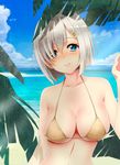 arm_behind_back bare_shoulders beach bikini bikini_top blue_eyes blue_sky blush breasts cloud day eyes_visible_through_hair hair_ornament hair_over_one_eye hairclip hamakaze_(kantai_collection) highres kantai_collection kiko_(okuwae) large_breasts looking_at_viewer navel ocean outdoors plant sand shore short_hair silver_hair sky smile solo swimsuit upper_body 