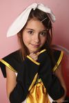  1girl child cosplay kagamine_rin kagamine_rin_(cosplay) laura_b looking_at_viewer photo pose ribbon smile solo uniform vocaloid watermark 