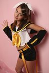  1girl child cosplay kagamine_rin kagamine_rin_(cosplay) laura_b looking_at_viewer navel photo pose ribbon smile solo uniform vocaloid watermark 