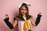  1girl child cosplay kagamine_rin kagamine_rin_(cosplay) laura_b looking_at_viewer photo pose ribbon smile solo uniform vocaloid watermark 