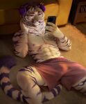 abs adelaherz anthro boxers_(clothing) boxers_only bulge cellphone clothed clothing electronics felid fur furniture headphones hi_res holding_cellphone holding_object holding_phone holding_smartphone inside looking_at_smartphone male mammal muscular muscular_anthro muscular_male pantherine phone purple_eyes purple_stripes shirtless smartphone sofa solo stripes tarin_nailo tattoo tiger topless underwear underwear_only whiskers white_body white_fur