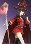  absurdres bandaged_leg bandages black_hair cape commentary_request dress eyepatch gradient gradient_background hat highres holding kono_subarashii_sekai_ni_shukufuku_wo! looking_at_viewer megumin parted_lips red_eyes short_dress short_hair simple_background solo staff witch_hat yueye_(blbl-y) 