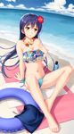  barefoot beach bikini blue_hair blush breasts cleavage flower full_body hair_flower hair_ornament highres innertube jewelry long_hair love_live! love_live!_school_idol_project medium_breasts navel necklace sitting smile solo sonoda_umi strapless swimsuit tubetop tucana yellow_eyes 