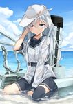  adjusting_hair azuuru beach belt between_legs black_legwear black_skirt blue_eyes blush cannon closed_mouth cloud cloudy_sky day expressionless flat_cap hair_flip hammer_and_sickle hand_between_legs hat hibiki_(kantai_collection) highres kantai_collection long_hair long_sleeves looking_at_viewer machinery messy_hair neckerchief ocean outdoors partially_submerged pleated_skirt rigging sailor_collar sand school_uniform see-through serafuku silver_hair sitting skirt sky sleeves_rolled_up smokestack solo star thighhighs verniy_(kantai_collection) wariza water wet wet_clothes wet_hair 