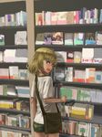  bag blonde_hair blue_eyes blush book bookshelf casual emblem facing_viewer fang furukawa_herzer girls_und_panzer highres katyusha messenger_bag pravda_(emblem) shirt shop shorts shoulder_bag solo t-shirt white_shirt 