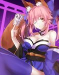  animal_ears blue_legwear bow breasts cleavage collar collarbone detached_sleeves fate/extra fate_(series) fox_ears fox_tail hair_bow hair_ribbon highres japanese_clothes large_breasts looking_at_viewer minamina ofuda one_eye_closed pink_hair ribbon solo tail tamamo_(fate)_(all) tamamo_no_mae_(fate) torii upper_body yellow_eyes 