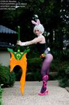  1girl animal_ears belt bent_over blondiee bunny_ears bunny_tail bunnysuit carrot cosplay english forest hair_ornament high_heels league_of_legends legs leotard looking_at_viewer makeup outdoor pantyhose photo pink_ribbon ribbon riven_(league_of_legends) short_hair sword tagme tie weapon white_hair 
