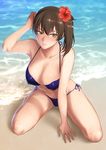  arm_up armpits beach bikini blue_bikini breasts brown_eyes brown_hair cleavage commentary_request flower hair_flower hair_ornament highres kaga_(kantai_collection) kantai_collection large_breasts long_hair outdoors sand shoukaki_(earthean) side_ponytail solo swimsuit water 