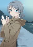  blue_eyes blush cellphone coat earphones grey_hair highres hood hood_down kumichou_(kumichoubox) looking_at_viewer love_live! love_live!_sunshine!! ocean phone short_hair silver_hair single_earphone_removed smartphone smile solo upper_body watanabe_you 