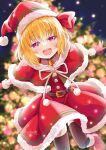  1girl artist_name black_thighhighs blonde_hair blurry capelet christmas christmas_tree depth_of_field dress hat looking_at_viewer night night_sky red_capelet red_dress red_headwear rumia sakuyabm santa_costume santa_hat sky smile solo thighhighs touhou 