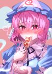  1girl black_ribbon blue_dress blue_headwear blush collared_dress commentary dango dress eating food food_on_face frilled_headwear hat heart heart-shaped_pupils highres hitodama long_sleeves looking_at_viewer mitarashi_dango mob_cap neck_ribbon pink_background pink_eyes pink_hair ribbon ribbon-trimmed_collar ribbon_trim saigyouji_yuyuko short_hair sleeve_garter solo spoken_heart symbol-shaped_pupils touhou triangular_headpiece upper_body user_twkm5737 wagashi 