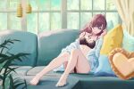  1girl absurdres ahoge barefoot black_bra black_panties blue_eyes blue_shirt bra brown_hair couch curtains day english_commentary full_body heart heart-shaped_pillow highres ichinose_shiki idolmaster idolmaster_cinderella_girls leaning_to_the_side looking_at_viewer navel on_couch on_pillow open_clothes open_shirt panties parted_lips pillow plant potted_plant qingli_ye shirt sitting smile solo sunlight thighs tree underwear window 