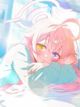  1girl ahoge bed_sheet blue_archive blue_eyes blue_pajamas blush closed_mouth hair_between_eyes halo heterochromia highres hoshino_(blue_archive) indoors itsk_ne long_hair long_sleeves lying on_stomach pajamas pink_hair pink_halo smile solo yellow_eyes 