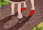  2girls black_footwear black_skirt commentary grass hakurei_reimu highres kirisame_marisa momo_ga_suki_desu multiple_girls outdoors pavement red_footwear shadow skirt standing touhou 