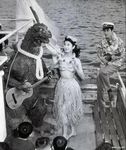  dancing godzilla godzilla_(series) greyscale guitar hawaiian_shirt hula_dancer hula_girl hula_skirt human japan kaiju lei luau mammal monochrome musical_instrument photography real scalie sea suit ukulele unknown_artist water 