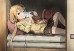  ahoge black_eyes black_skirt buttons candy candy_wrapper chewing commentary_request earbuds earphones earphones_removed food futaba_anzu handheld_game_console holding idolmaster idolmaster_cinderella_girls kamemaru light long_hair long_sleeves looking_at_viewer low_twintails lying on_back on_bed pillow playstation_portable pleated_skirt skirt solo stuffed_animal stuffed_bunny stuffed_toy sweater twintails wrapper 