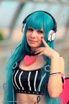  1girl 5pb_(choujigen_game_neptune) blue_hair choujigen_game_neptune cosplay female headphones neptune_(series) photo solo upper_body 