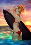  ass bikini blonde_hair commentary_request fate/apocrypha fate/grand_order fate_(series) front-tie_top green_eyes hair_pull hair_pulled_back highres kaze_minoru_so-ru looking_at_viewer looking_back mordred_(fate)_(all) mordred_(swimsuit_rider)_(fate) open_mouth orange_hair orange_sky red_bikini side-tie_bikini sky solo sunset surfboard swimsuit wading water 