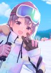  1girl bangs beanie blue_sky blush brown_eyes brown_hair cloud commentary_request day drawstring eyebrows_visible_through_hair fur-trimmed_jacket fur_trim gloves goggles goggles_on_head hands_up hat highres holding idolmaster idolmaster_cinderella_girls jacket leaning_to_the_side long_sleeves mountain otokura_yuuki outdoors pink_gloves red_hat ski_goggles sky sleeves_past_wrists snow solo uso_(ameuzaki) v white_jacket 