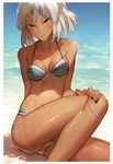  altera_(fate) bare_shoulders beach bianyuanqishi bikini black_nails blush breasts collarbone dark_skin day fate/extella fate/extra fate/grand_order fate_(series) hand_on_own_knee looking_at_viewer nail_polish navel outdoors red_eyes shore short_hair sitting small_breasts solo swimsuit tattoo water wet white_hair 
