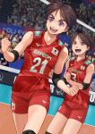  2girls brown_eyes brown_hair clenched_hand company_name crowd elbow_sleeve highres indoors multiple_girls original otsu_natsu red_shirt red_shorts shirt short_hair shorts sportswear standing thick_eyebrows volleyball volleyball_net volleyball_uniform 