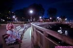  1girl bench blonde_hair city cloud cosplay dutch_angle fence kaname_madoka lana_rain magical_girl mahou_shoujo_madoka_magica night outdoors park photo plant shoes sitting sky solo tree twintails white_legwear 