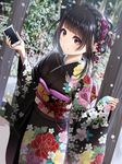  bangs black_hair black_kimono blush braid brown_eyes cellphone commentary crown_braid dutch_angle floral_print flower forest furisode hair_flower hair_ornament hairpin hands_up holding holding_cellphone holding_phone japanese_clothes kentaurosu kimono light_smile long_sleeves looking_ahead matsuno_chiya nature new_year obi obiage obijime original outdoors phone phone_with_ears plant sash sidelocks smartphone snowing solo standing tree updo wide_sleeves 