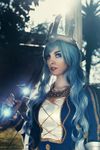  ashe_(league_of_legends) blue_eyes blue_hair bow cosplay crown ice league_of_legends long_hair looking_at_viewer make_up queen valentina_kryp weapon 