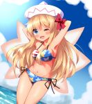 1girl ;d american_flag_bikini armpits arms_behind_back arms_up bikini blonde_hair blue_eyes blush bow cloud commentary_request flag_print highres horizon lily_white long_hair looking_at_viewer navel ocean one_eye_closed open_mouth outdoors red_bow ruu_(tksymkw) smile solo swimsuit tan touhou white_headwear 