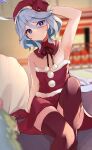  1girl absurdres ahoge alternate_costume arm_up armpits bare_arms bare_shoulders blue_eyes blue_hair blurry blurry_background blush commentary_request detached_collar dress feet_out_of_frame furina_(genshin_impact) genshin_impact gloves highres indoors long_hair looking_at_viewer pokeeeo_o red_dress red_gloves red_headwear red_thighhighs santa_costume sitting solo strapless strapless_dress thighhighs thighs very_long_hair 