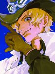 1boy ascot blonde_hair blue_background close-up gloves goggles goggles_on_headwear hat highres looking_down looking_to_the_side male_focus one_piece sabo_(one_piece) scar scar_on_face simple_background solo top_hat vasan5555 white_ascot 