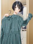  1girl black_eyes black_hair clothes_hanger dress floral_print_dress green_dress holding holding_clothes holding_dress indoors looking_at_viewer mattaku_mousuke original shirt short_hair solo standing sweater twitter_username unworn_clothes wardrobe white_sweater 