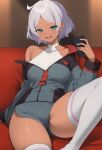  1girl aqua_eyes asticassia_school_uniform campbell_xx commentary_request couch dark-skinned_female dark_skin fingernails green_jacket green_shorts grey_hair gundam gundam_suisei_no_majo halter_shirt halterneck highres holding holding_phone indoors jacket knee_up looking_at_viewer nail_polish off_shoulder on_couch open_mouth partially_unzipped phone school_uniform secelia_dote short_hair shorts single_bare_shoulder skindentation solo thighhighs thighs white_nails white_thighhighs 